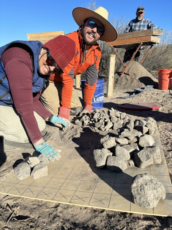 Sorting burned rocks at Canta Recio.