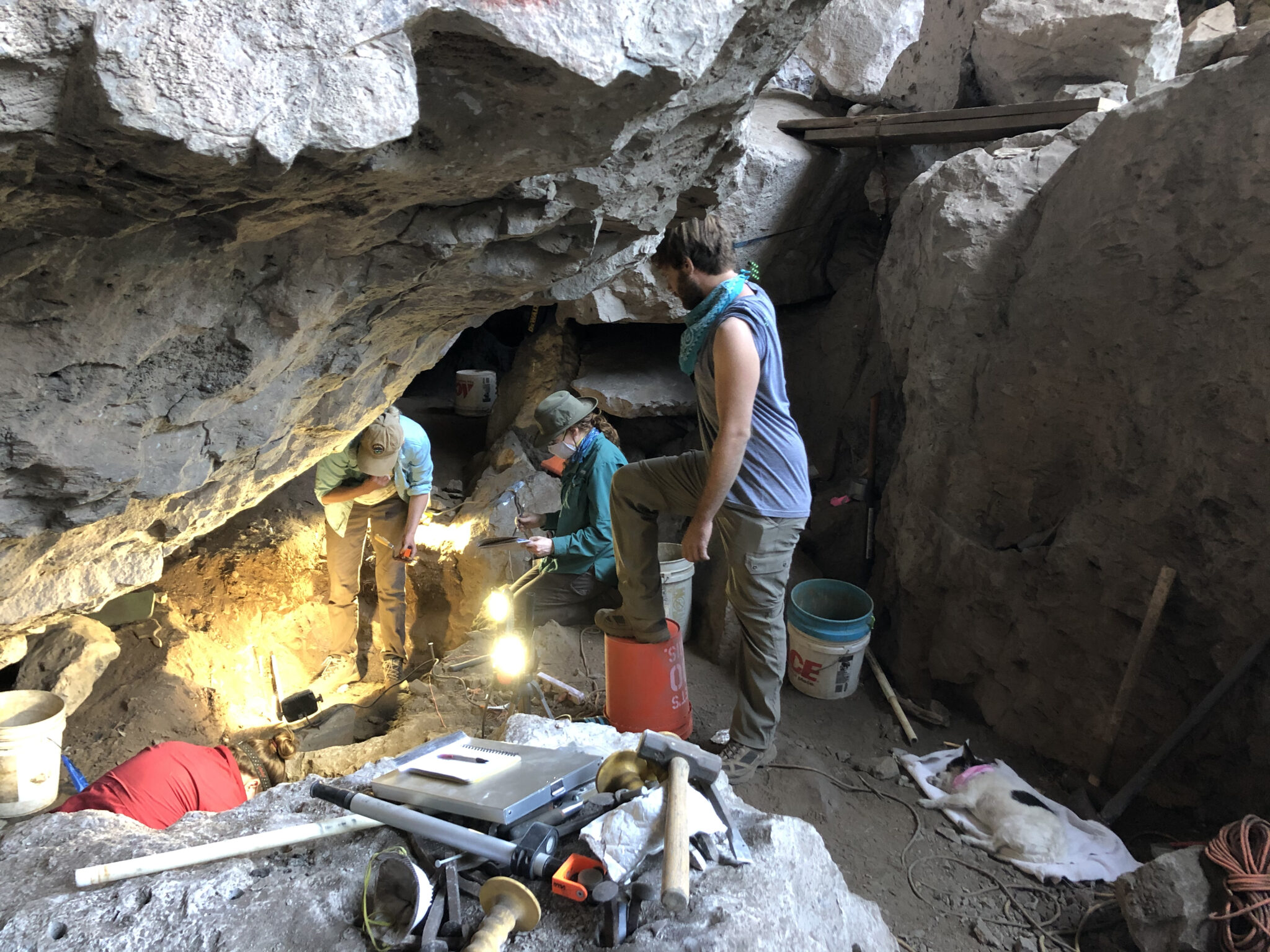People in a rockshelter archaeological site.