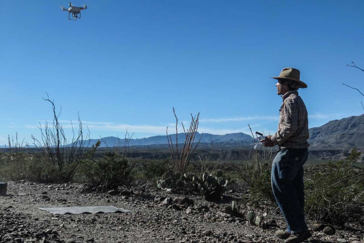 Sam Cason using drone for site overview